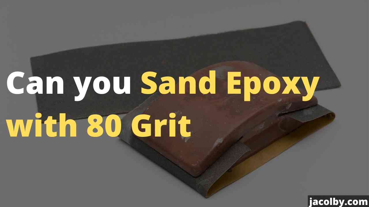 An 80 grit sandpaper being used to sand epoxy resin surface